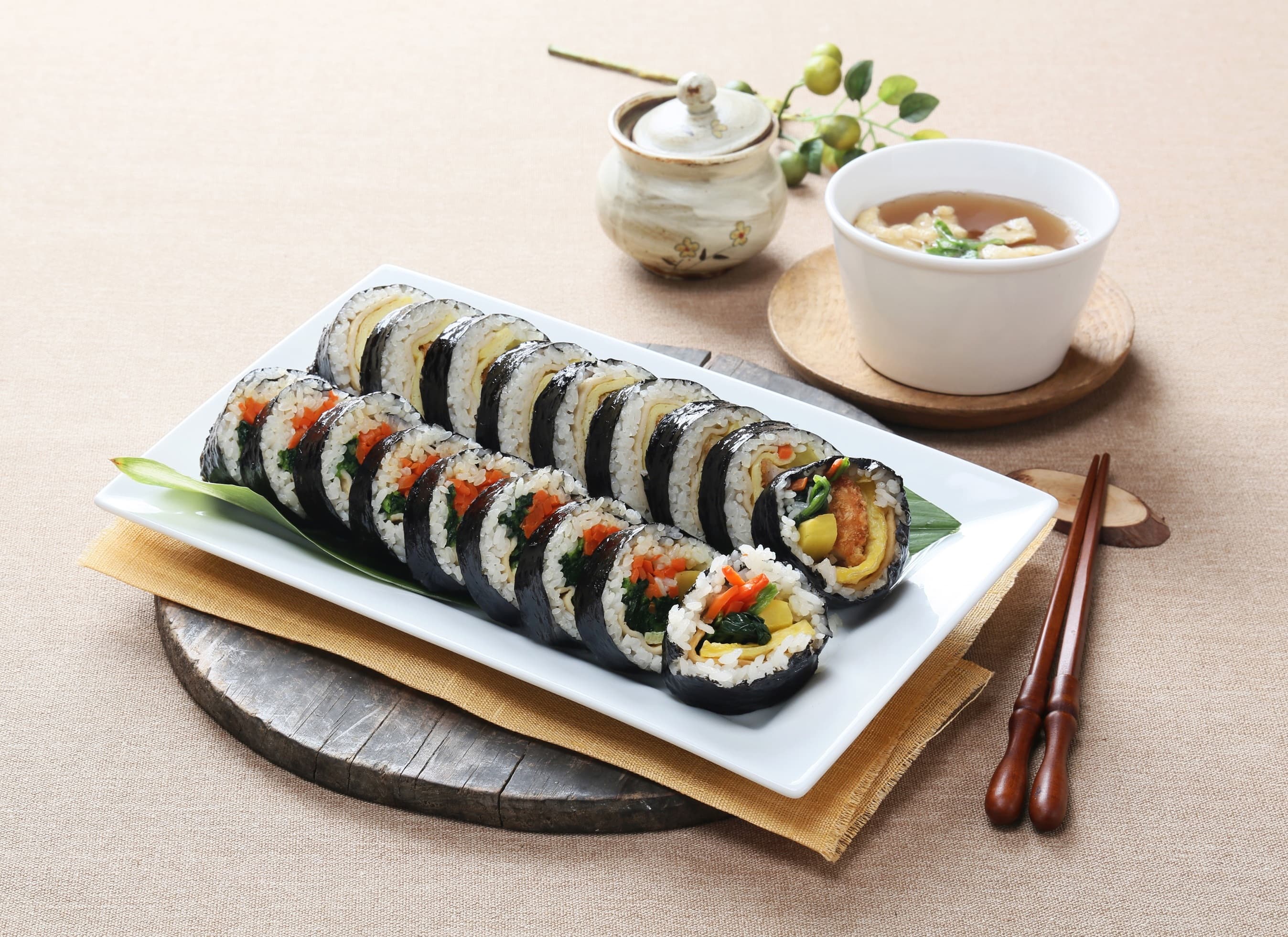 Sliced kimbap rolls showing colorful pinwheel cross-section