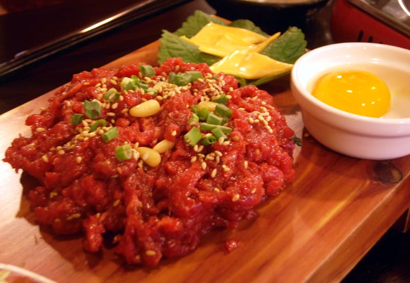 Yukhoe Korean beef tartare with egg yolk and pear strips