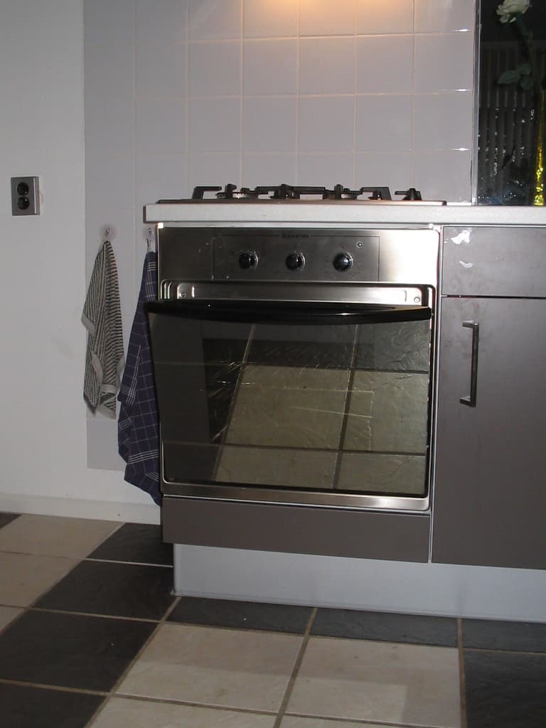 Oven-baked beef ribs with sticky glaze on a wooden board