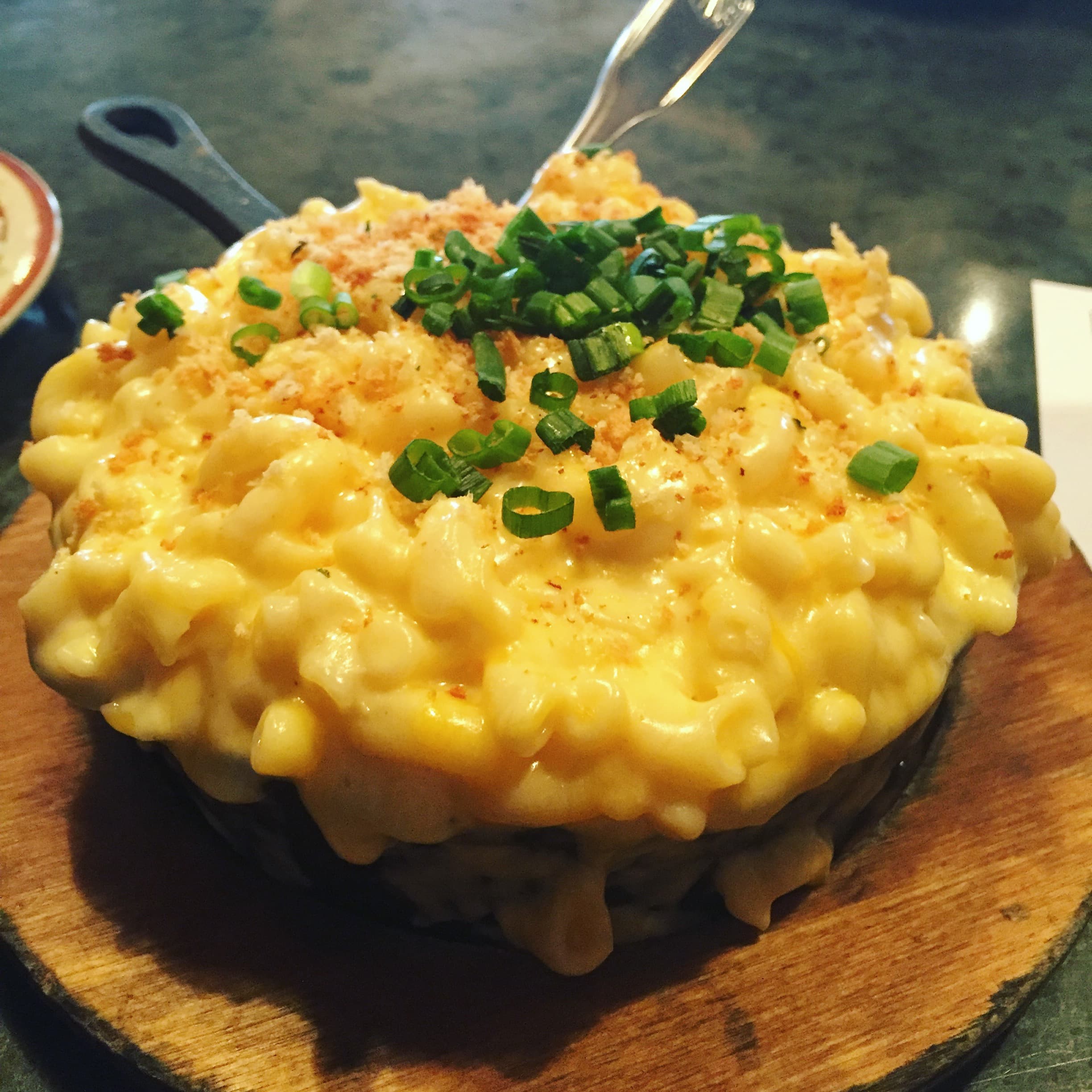 Cast-iron pan of smoked mac and cheese with golden top