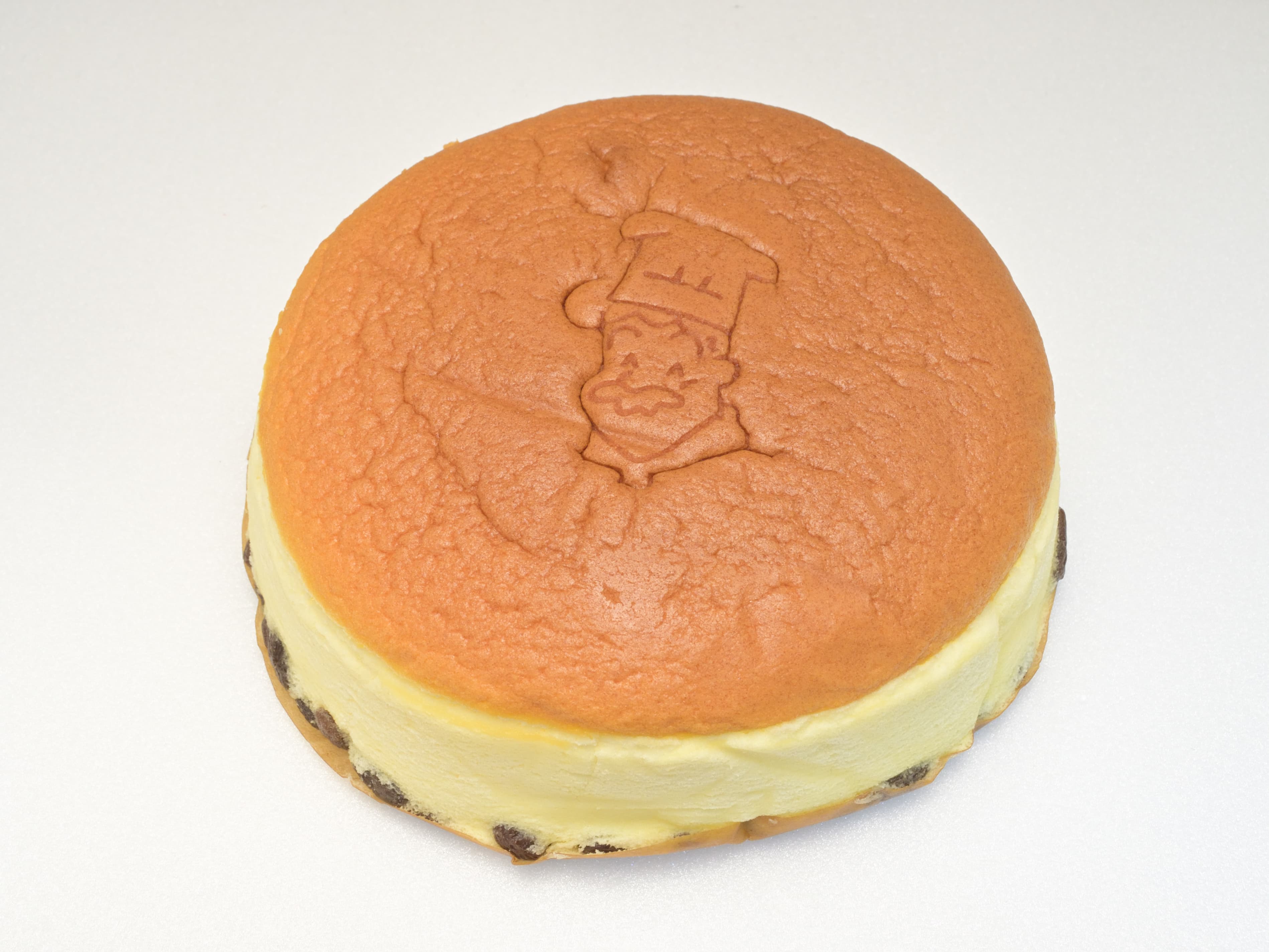Jiggly Japanese cheesecake with a golden top wobbling on a plate