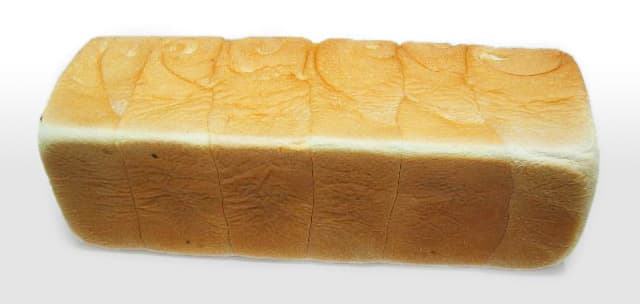 Sliced Japanese milk bread loaf showing fluffy white crumb