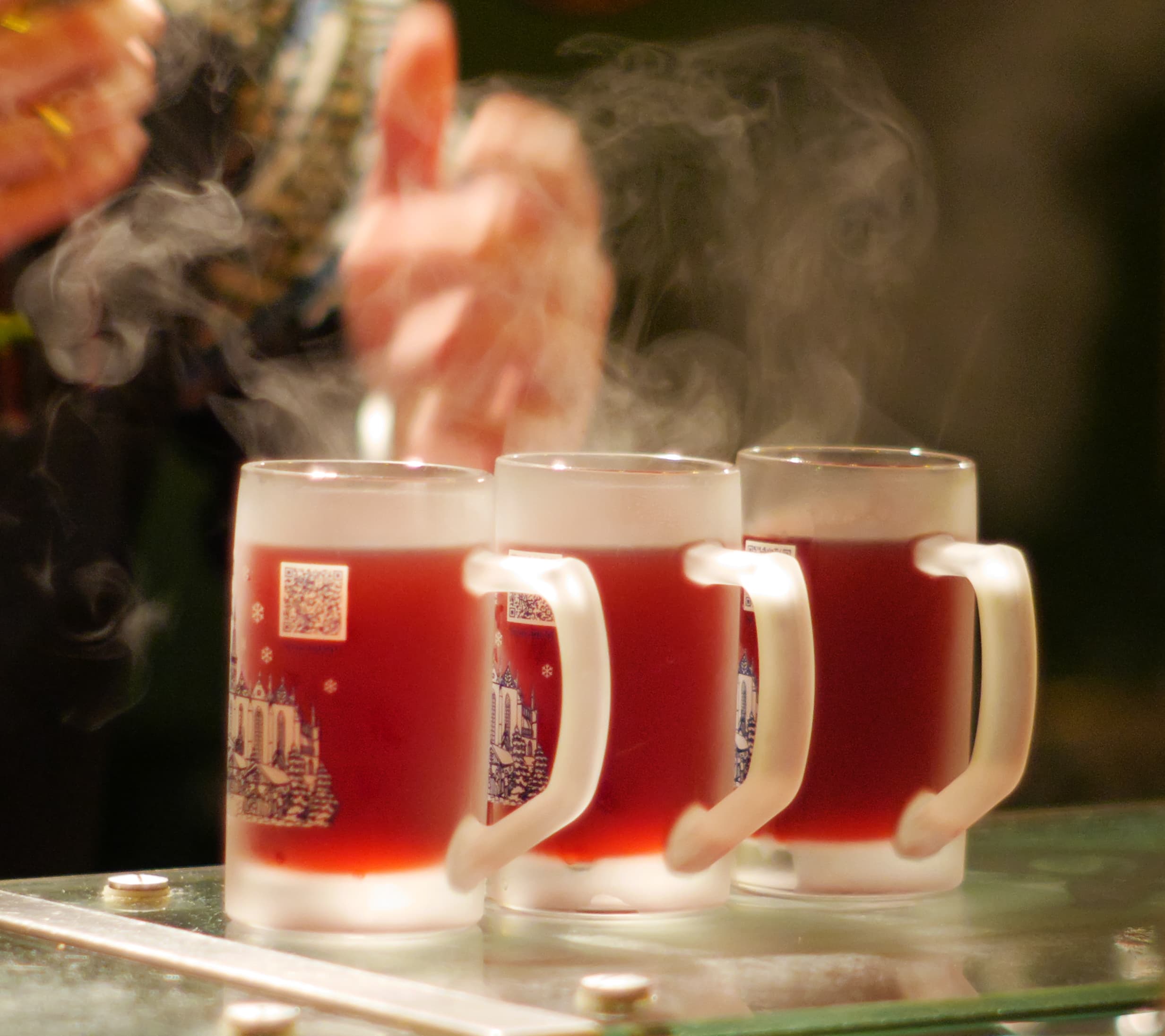 Glasses of mulled wine with cinnamon sticks and star anise