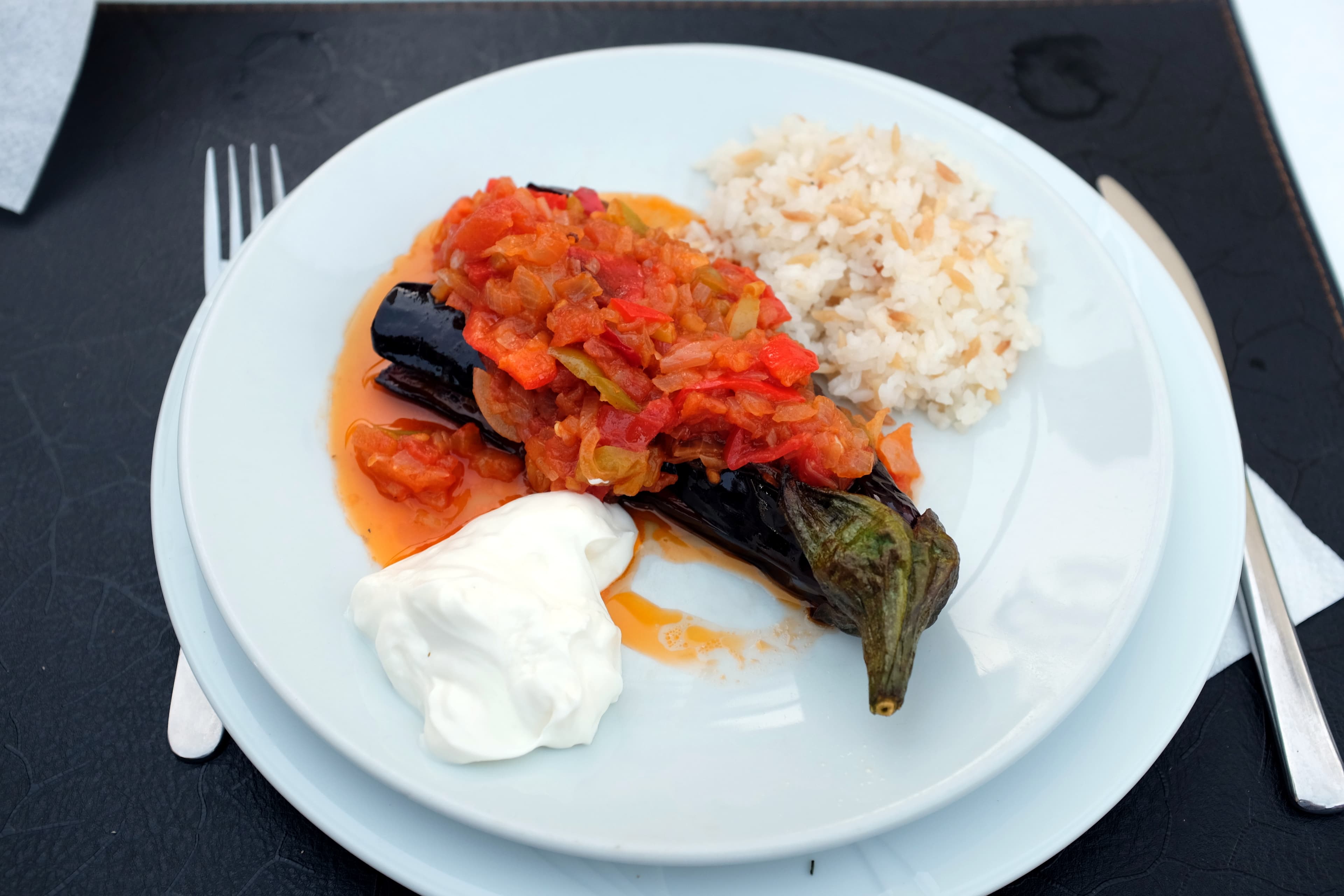 Turkish imam bayildi stuffed eggplant in olive oil sauce