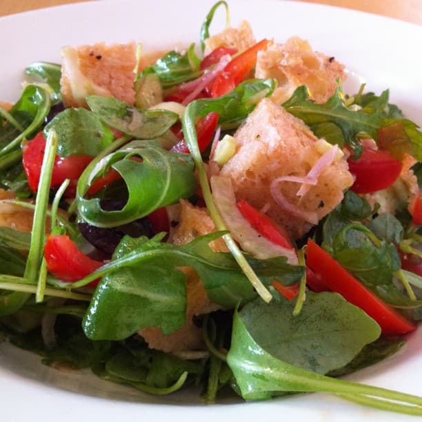 Patatas bravas with spicy red sauce and aioli drizzle