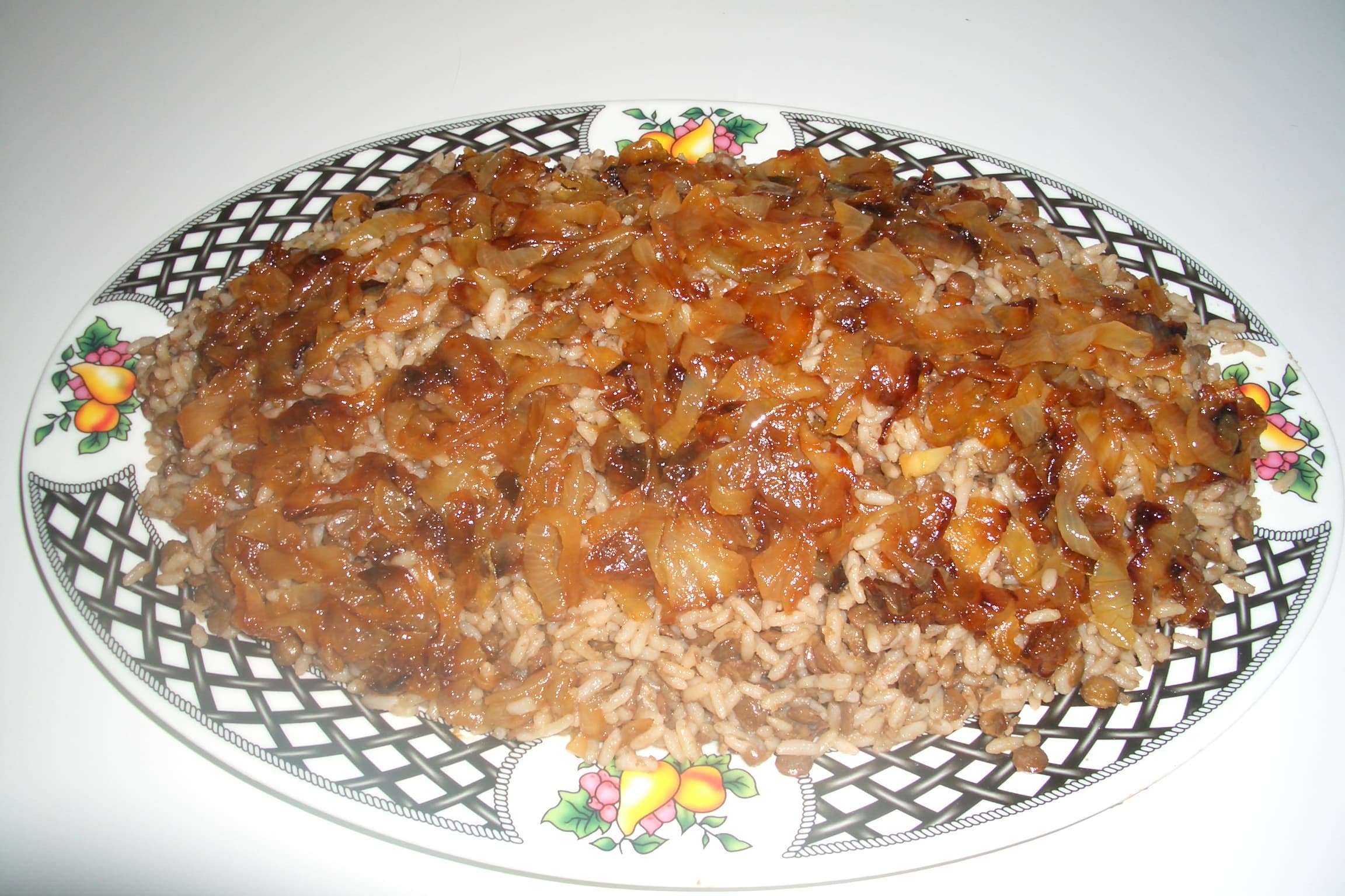 Bowl of mujadara lentils and rice with caramelized onions