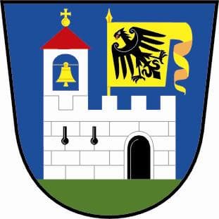 Sliced herb-roasted pork tenderloin on a cutting board