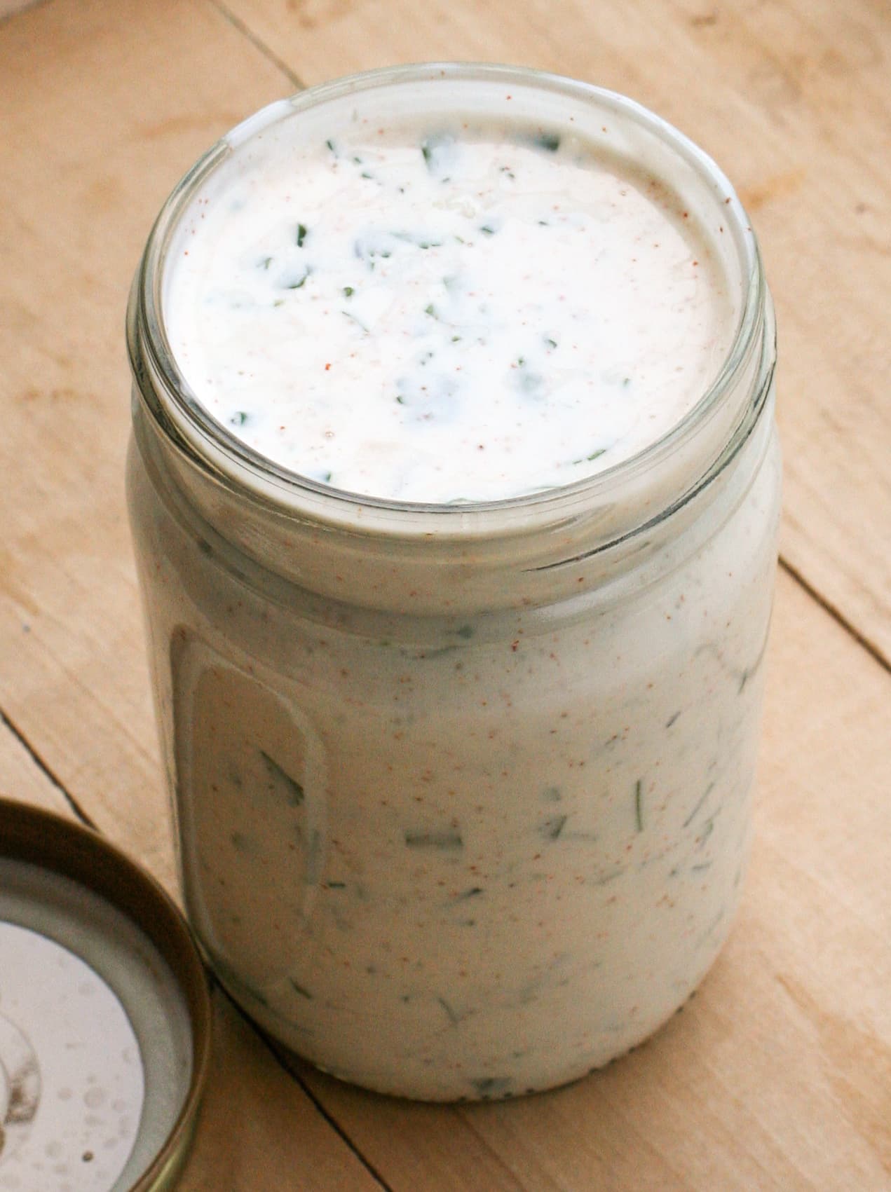 Creamy ranch dressing drizzled over a fresh garden salad