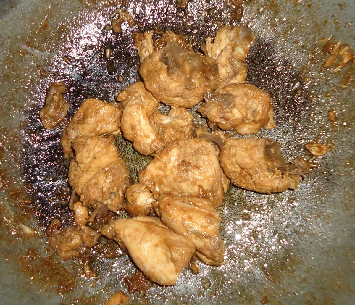 Crispy chicken thighs in lemon garlic butter sauce in a cast iron skillet