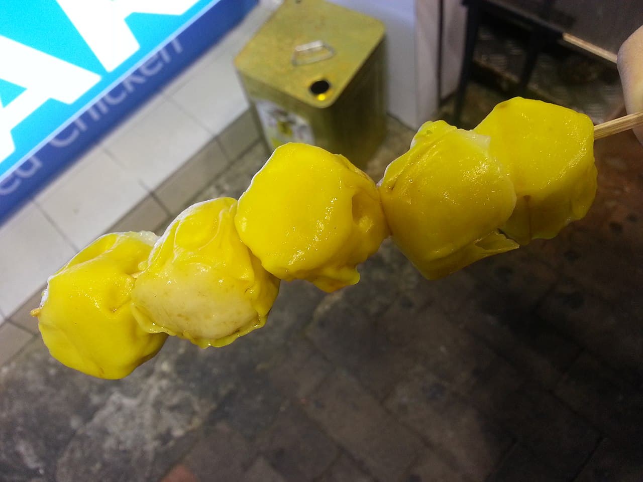 Bubbly Korean corn cheese in a cast-iron skillet