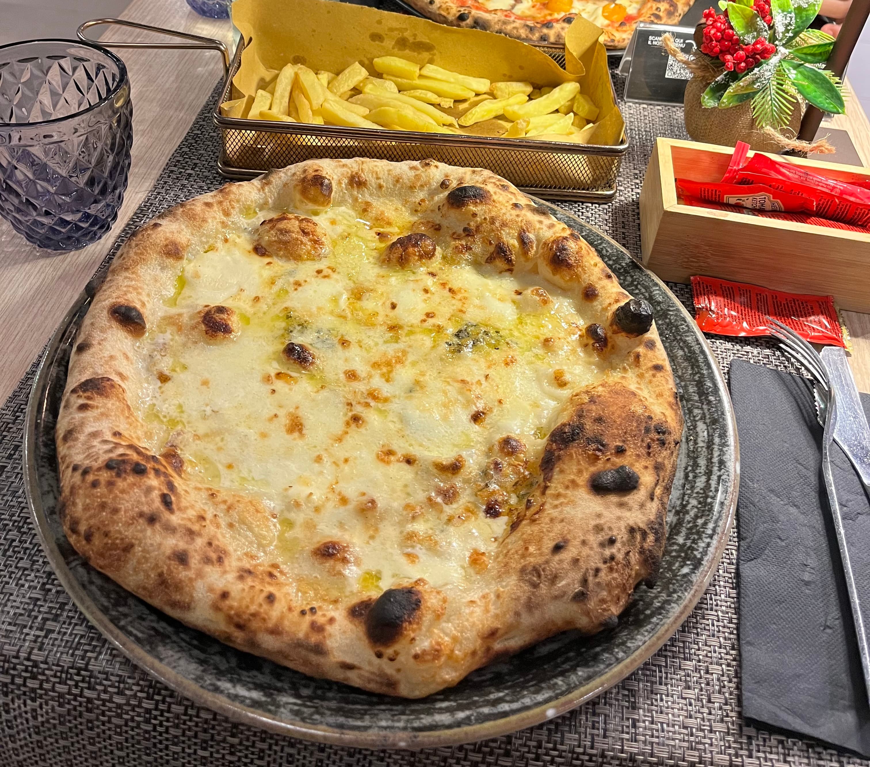 Pizza quattro formaggi with four melted Italian cheeses