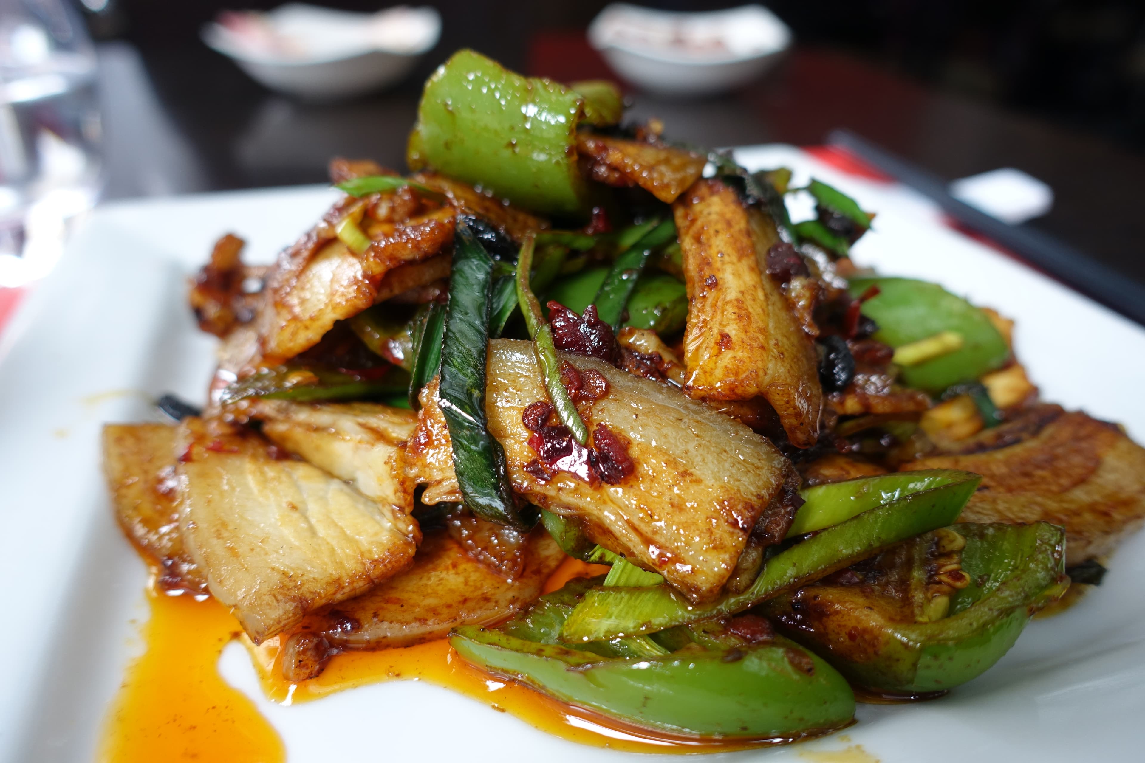 Twice cooked pork belly slices stir-fried with leeks and peppers